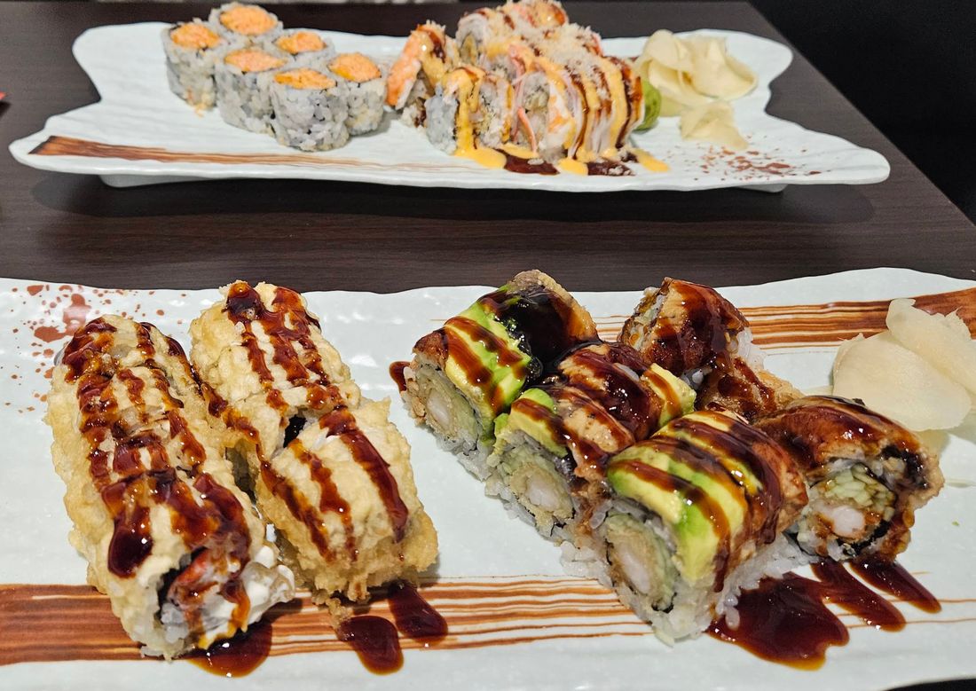 Two plates of sushi rolls at Arctic Bites